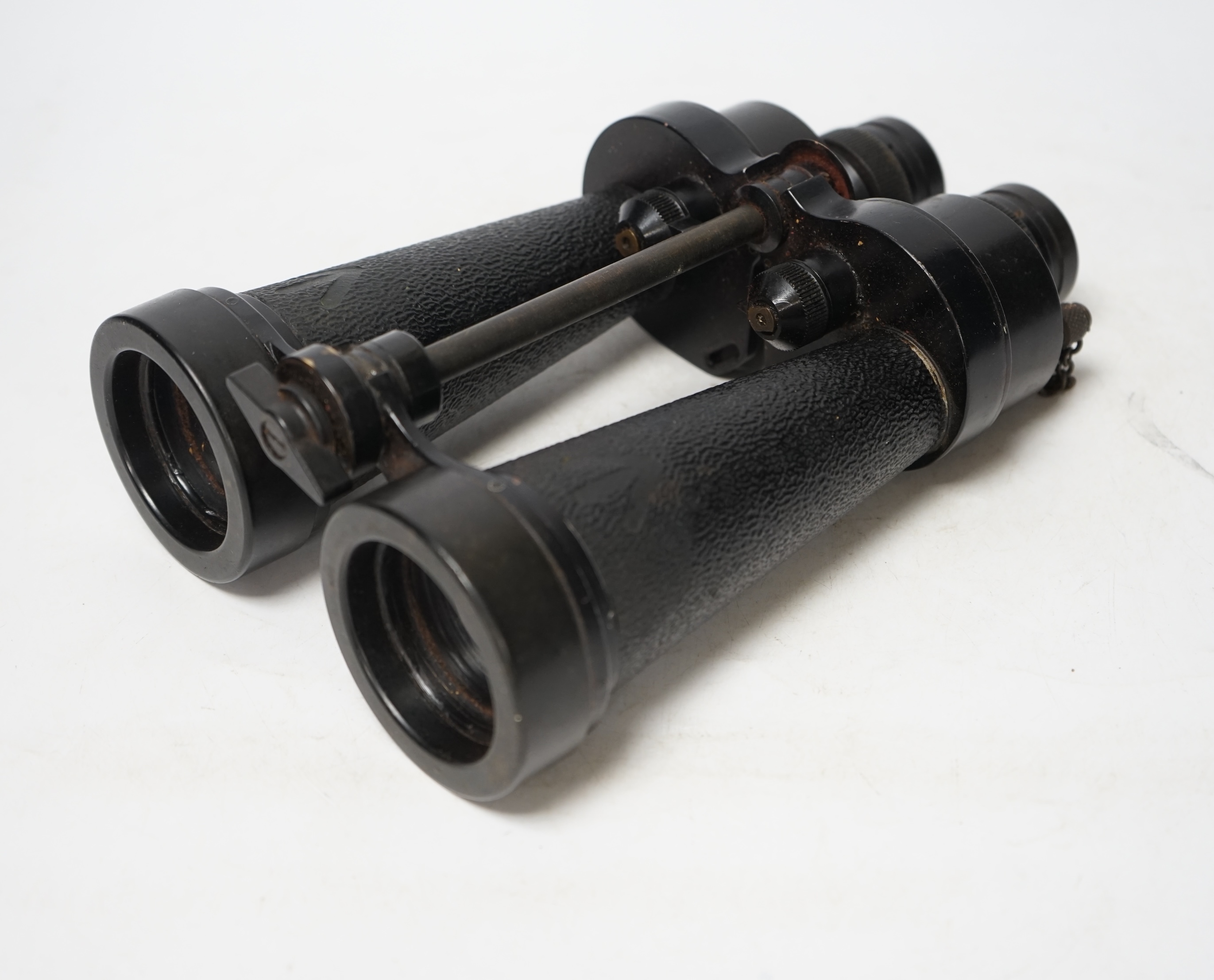 A pair of brown leather cased WWII Naval binoculars, Barr & Stroud, binoculars 24cm long, Condition - leather shoulder strap missing, front strap worn from use, binoculars appear good/used